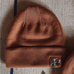 Brown Knit Beanie Hat with bronc rider